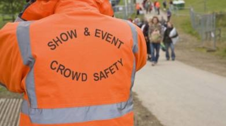 A person managing crowd safety at an event