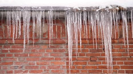 Icicles on roof, ice dam.
