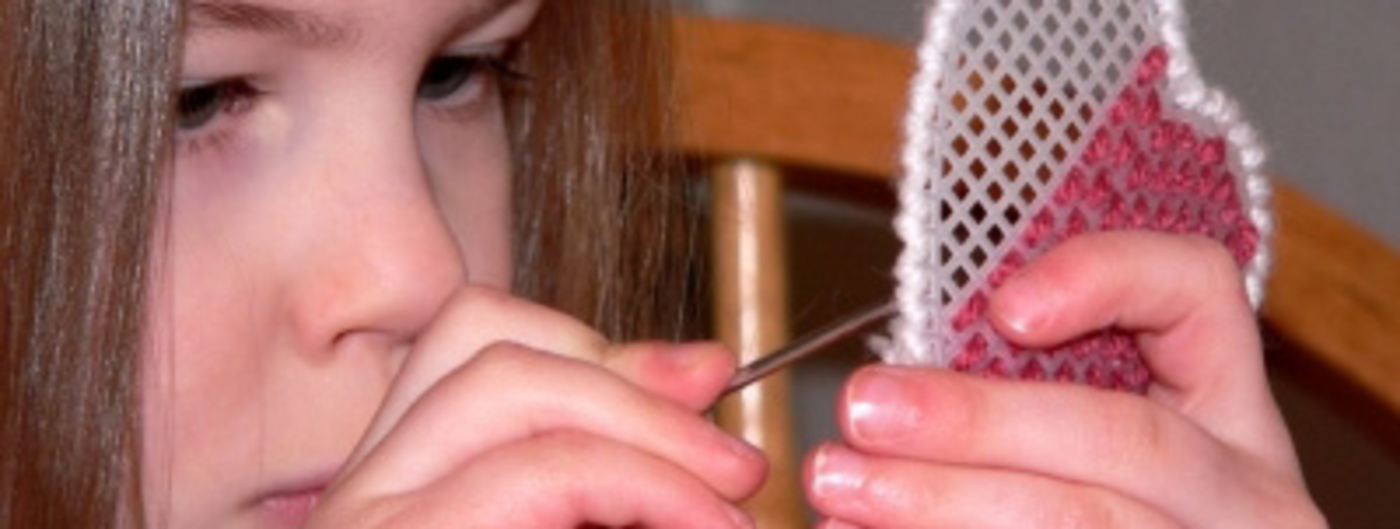 girl doing needle arts