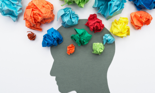 Graphic of a profile head with balls of colorful paper rising up from it to symbolize thoughts.