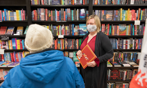 A bookstore manager talking to a customer.