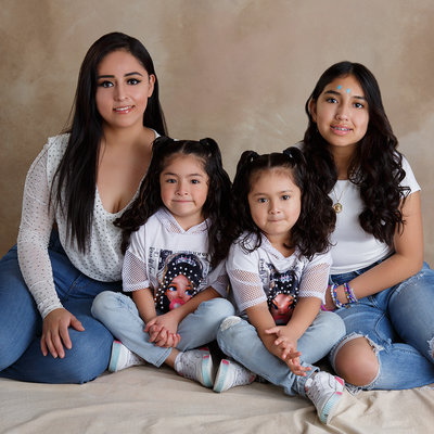 A family photo of Tatiana and her three daughters.