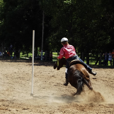 Youth member riding horse in games event
