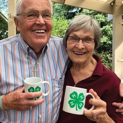 Eldon Tessman and Elaine Christiansen with 4-H mugs