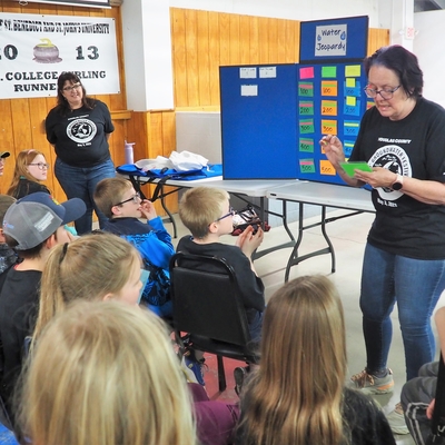 Kids prepare to answer questions for adults leading Water Jeopardy