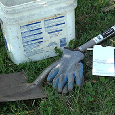 Bucket, shovel, gloves, and soil testing bag.