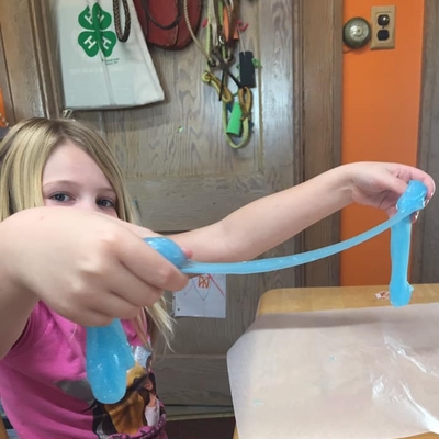kid holding slime