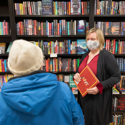 A bookstore manager talking to a customer.