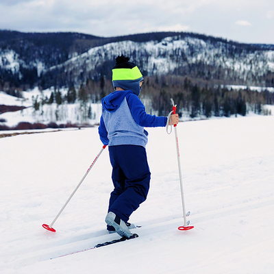 Young boy cross-country skiing.