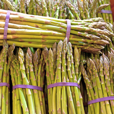 Bunches of green asparagus spears at a market