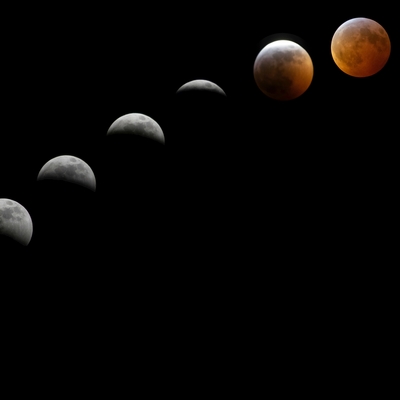 The phases of the moon shown at a diagonal on a black background.