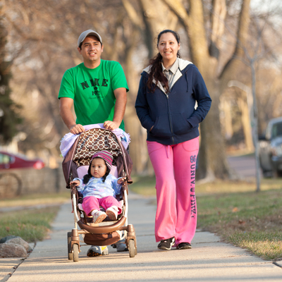 An Hispanic family with a child in a stroller