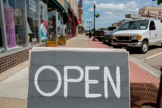 Downtown business open sign