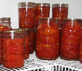 Jars of home canned tomatoes.
