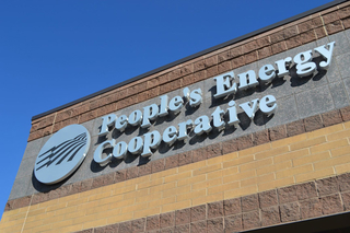 People's Energy Cooperative name and logo on the front of their building.