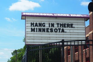 Hang in there Minnesota text on a State Fair sign 
