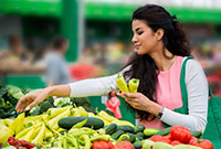 Woman choosing peppers